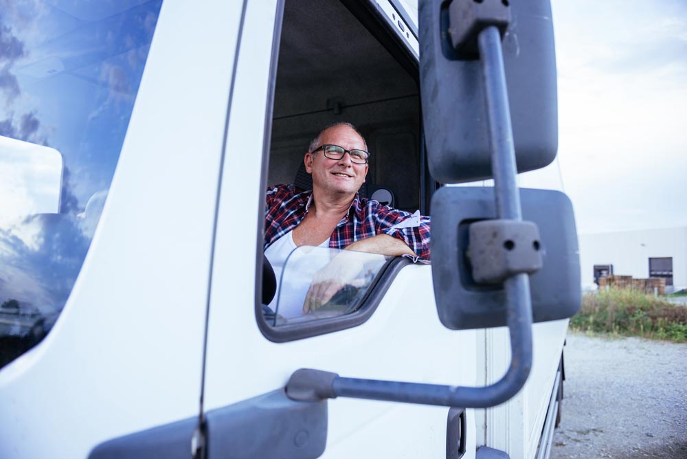 A truck driver hard at work.