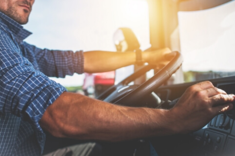 A truck driver hard at work.